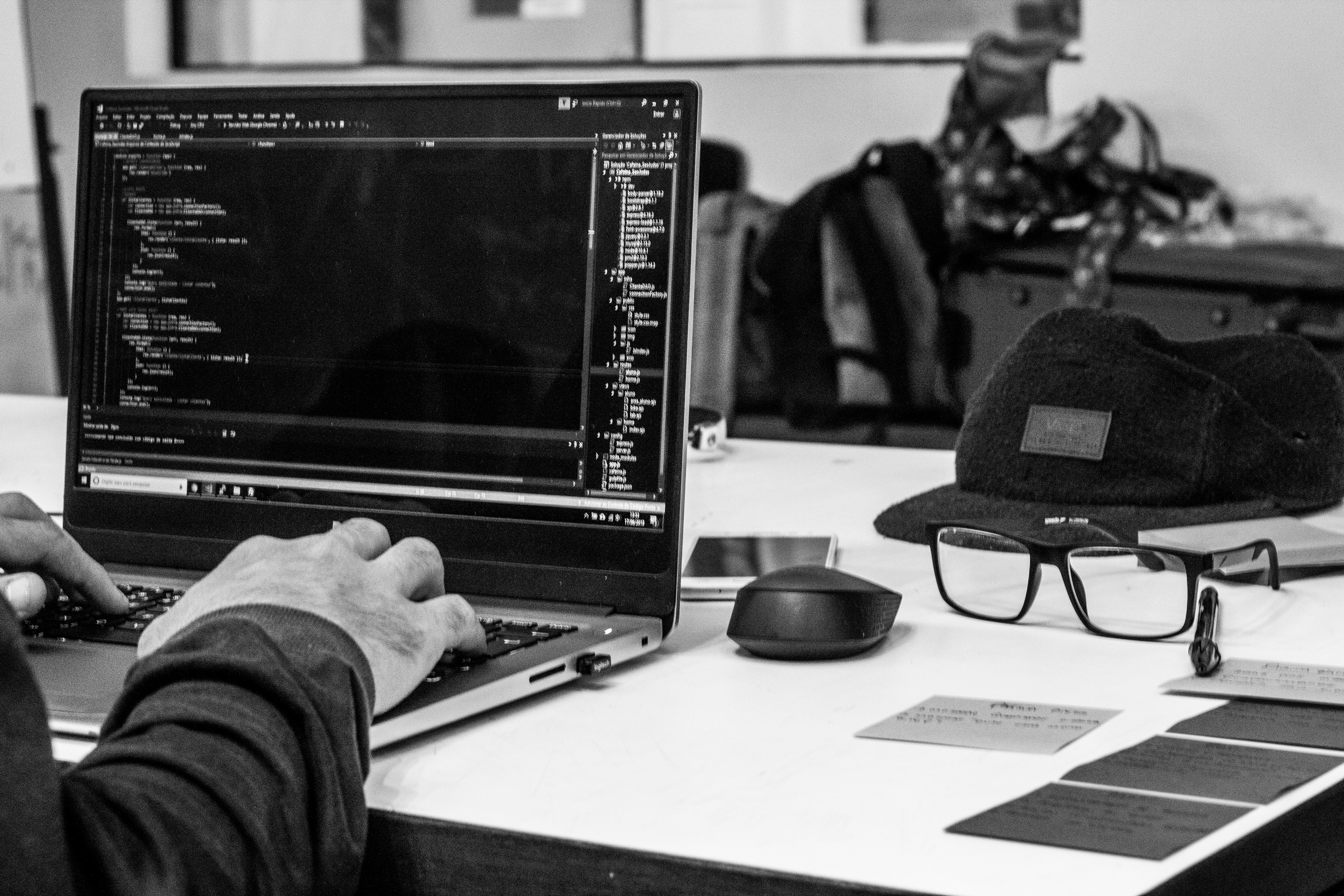 man coding at computer