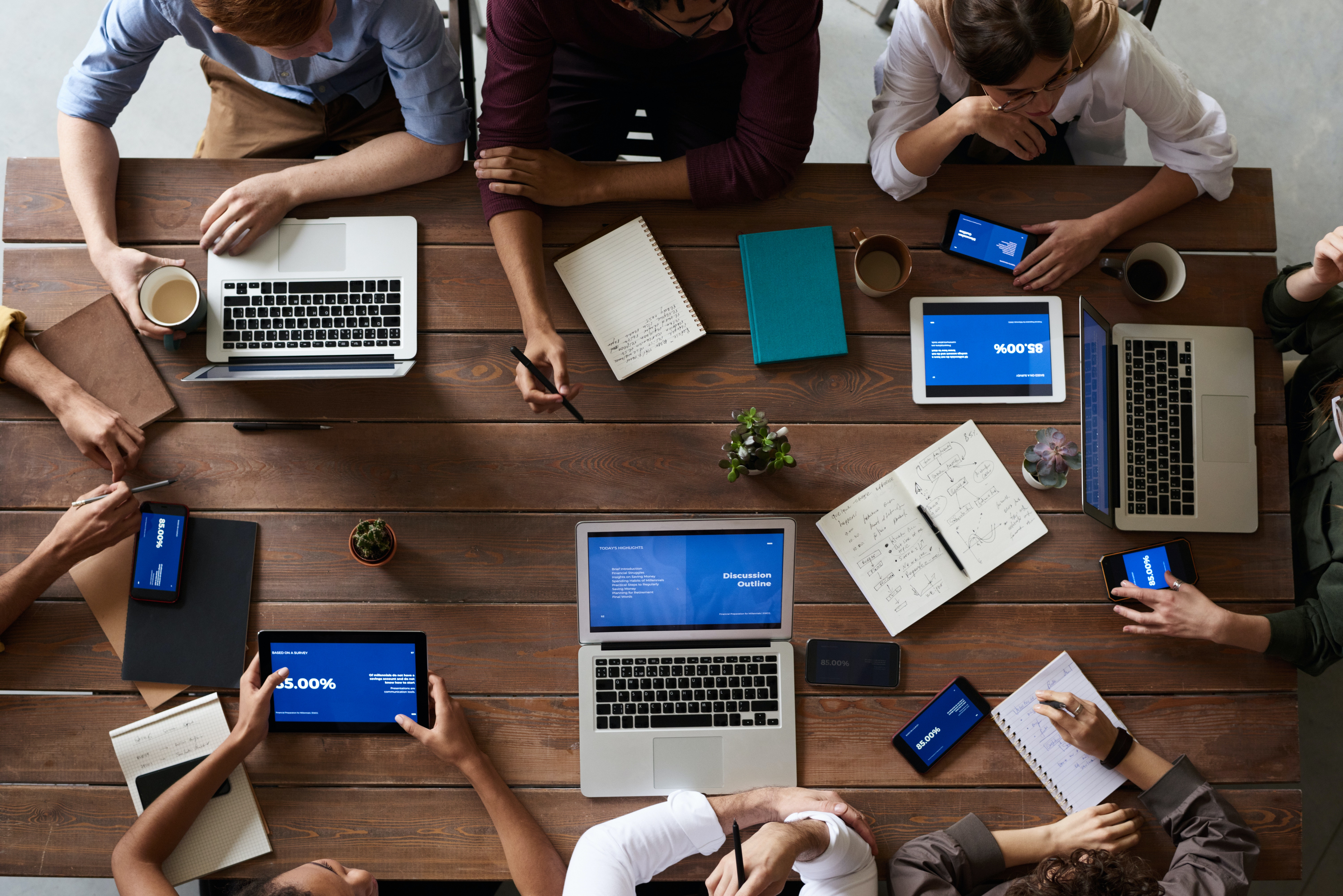 group of employees working around a table